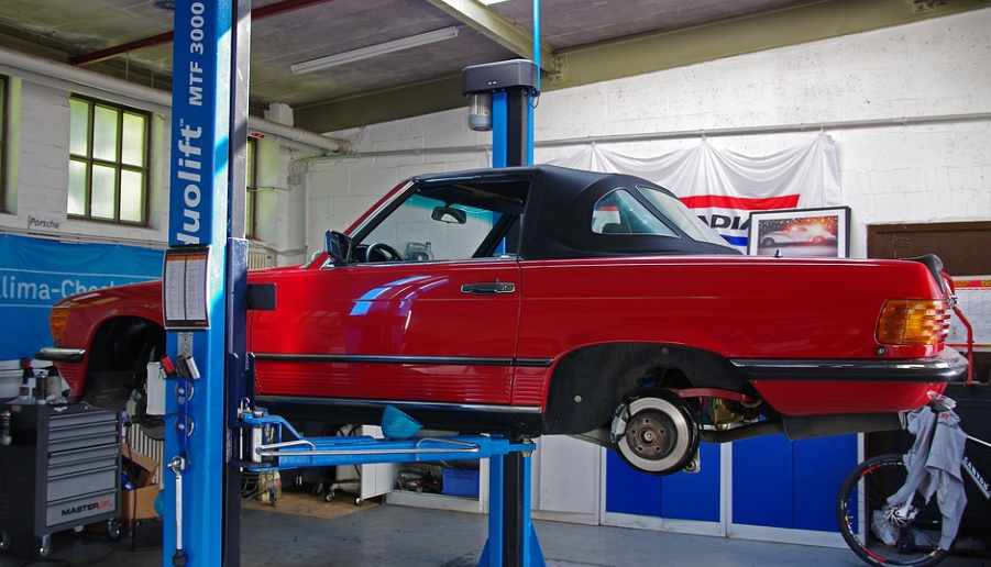 car on lift in workshop